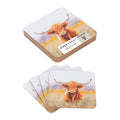 Two stacks of square coasters with rounded corners, each printed with a watercolor illustration of a Highland cow in a field. One coaster on top shows the brand label 'COCO & GARY COASTER' and 'Highlands'.