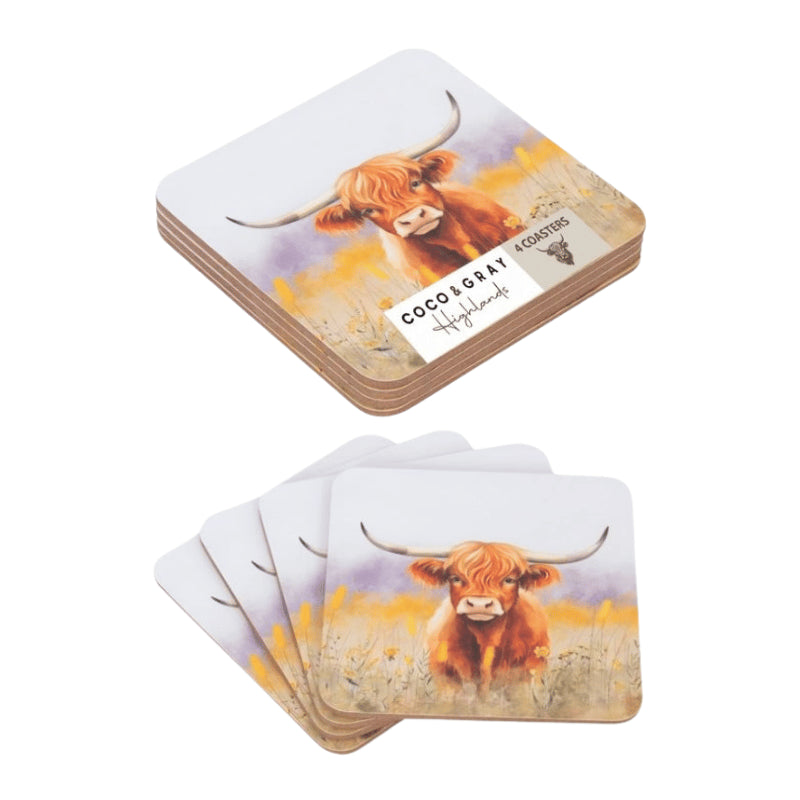 Two stacks of square coasters with rounded corners, each printed with a watercolor illustration of a Highland cow in a field. One coaster on top shows the brand label 'COCO & GARY COASTER' and 'Highlands'.