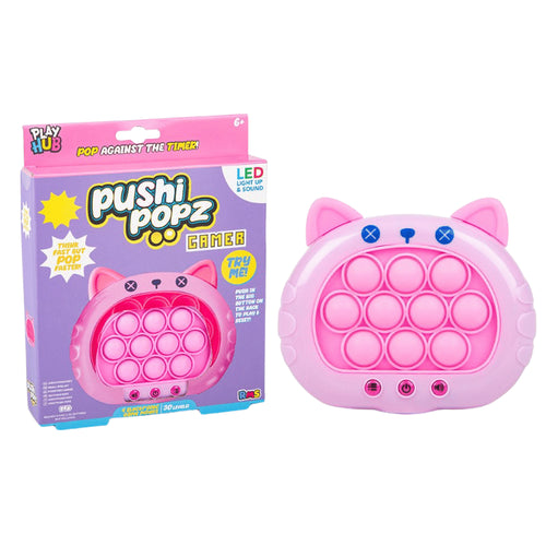 A pink cat-shaped pop toy shown next to its retail packaging box on a plain white background. The box is purple and pink with the brand name 'Play Hub' and product name 'Pushi Popz Game'.