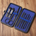 Mad Man Blue Grooming Kit with wood background